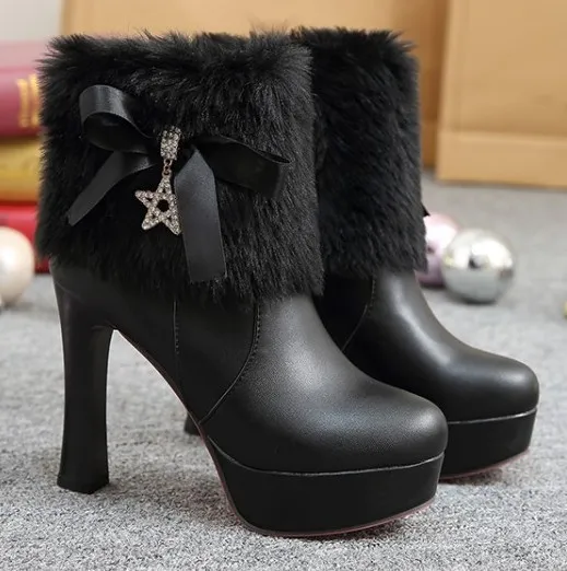 High heels boots in black with gold star, ankle fur