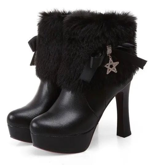 High heels boots in black with gold star, ankle fur