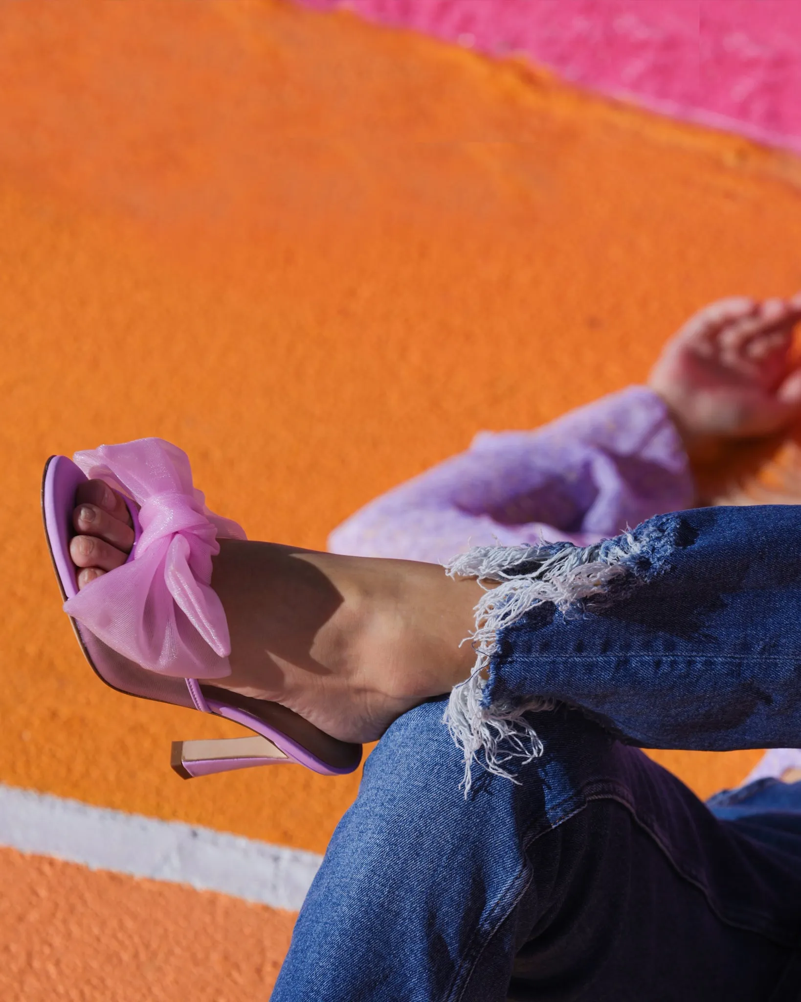 Violet bow mule with 85mm heel height.