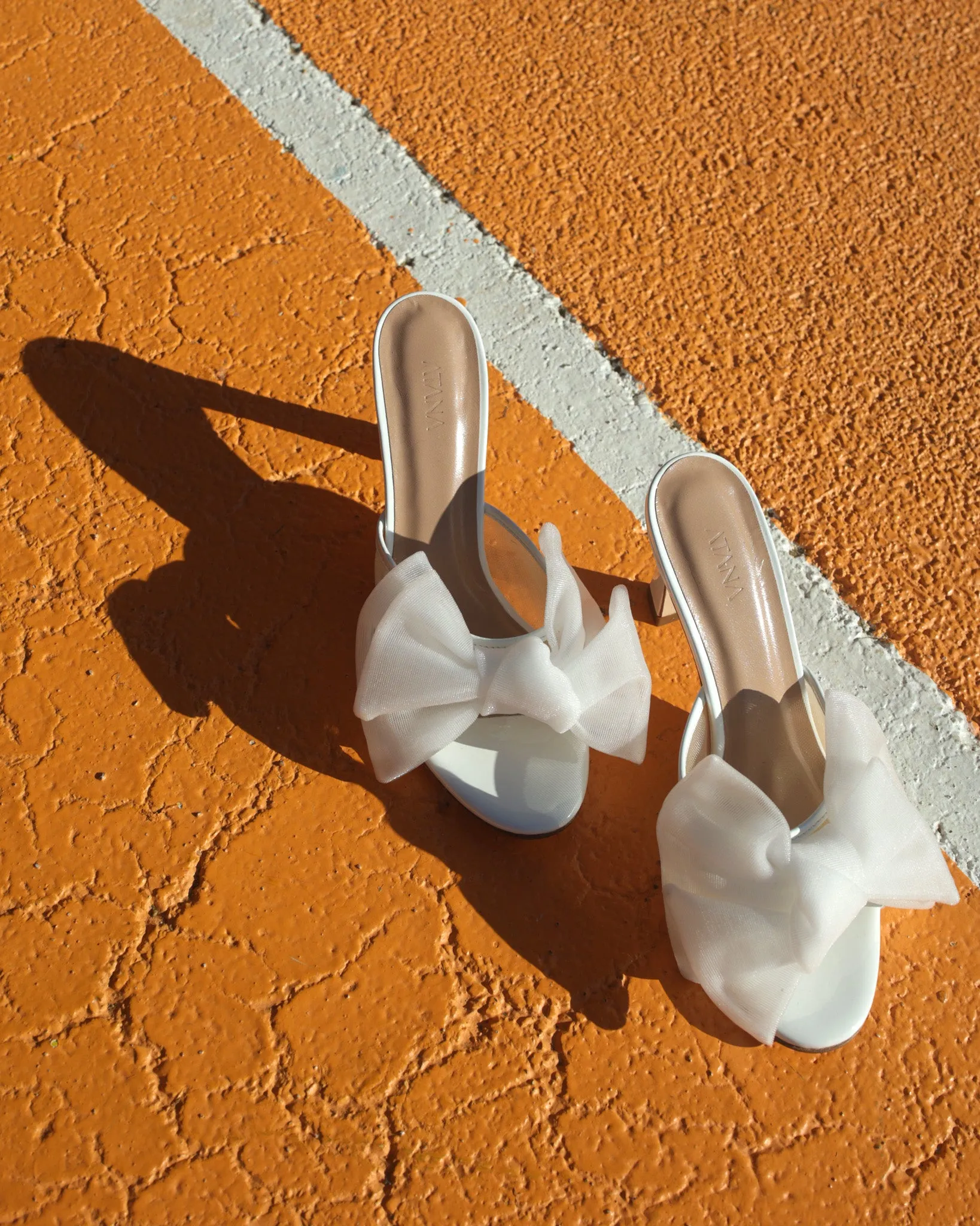 White Patent Bow Mule 85