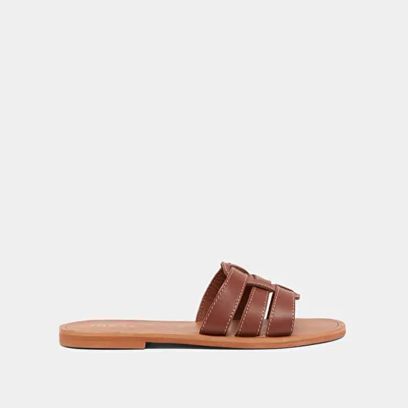 Cross-strap mules in cognac leather