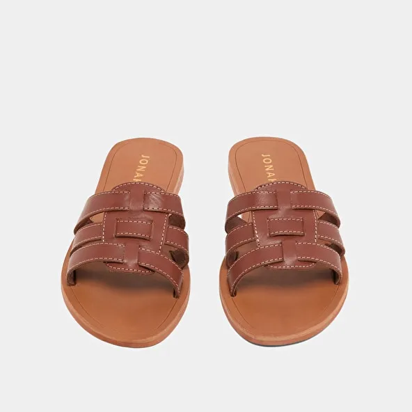 Cross-strap mules in cognac leather