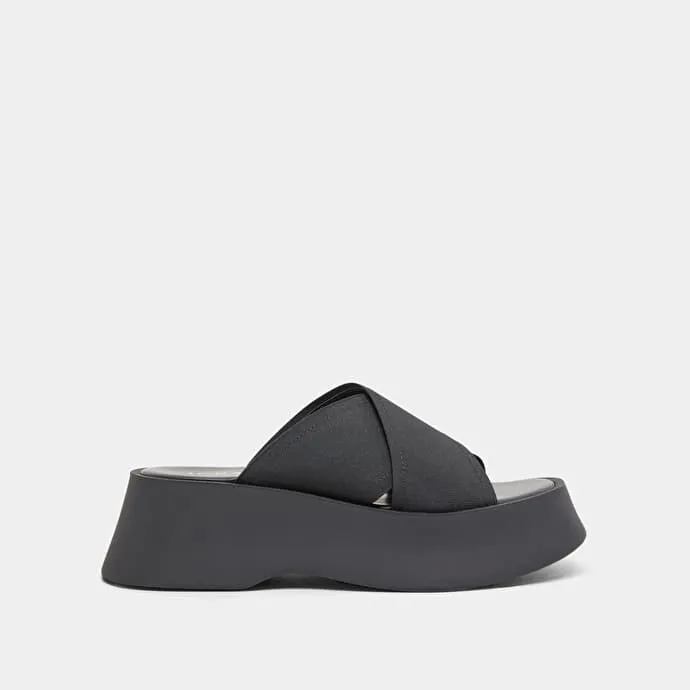 Cross-strap wedge mules in black elastic