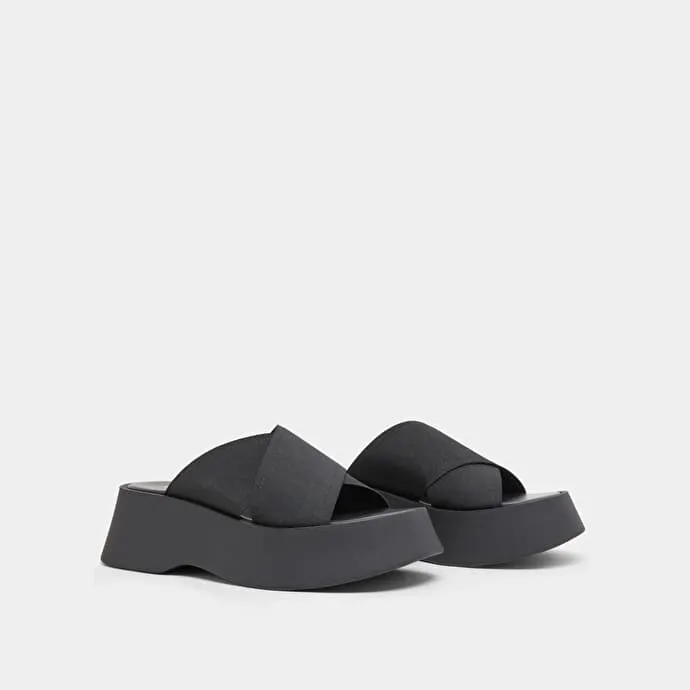 Cross-strap wedge mules in black elastic