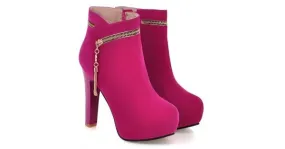 High heels boots in pink fuchsia suede with gold zipper